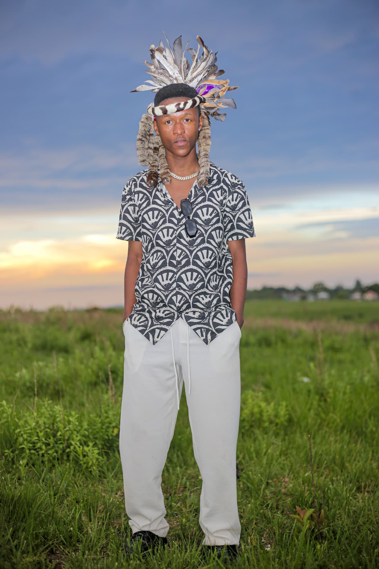 Sqiniseko SqinQ, South African Afro-pop artist, in denim and traditional Zulu headwear