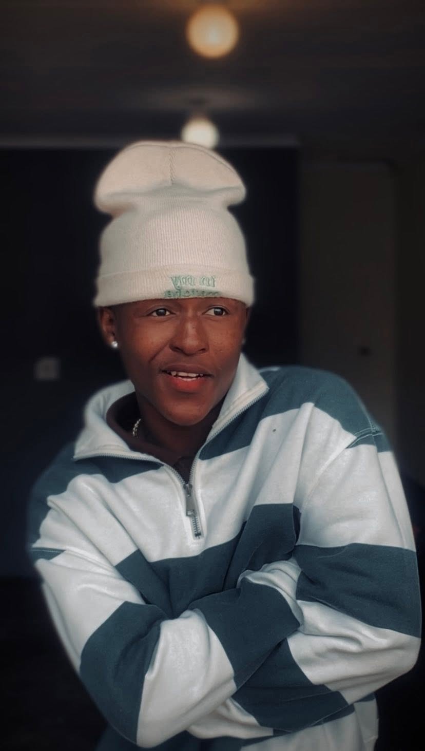 Sqiniseko SqinQ in a white beanie and tracksuit